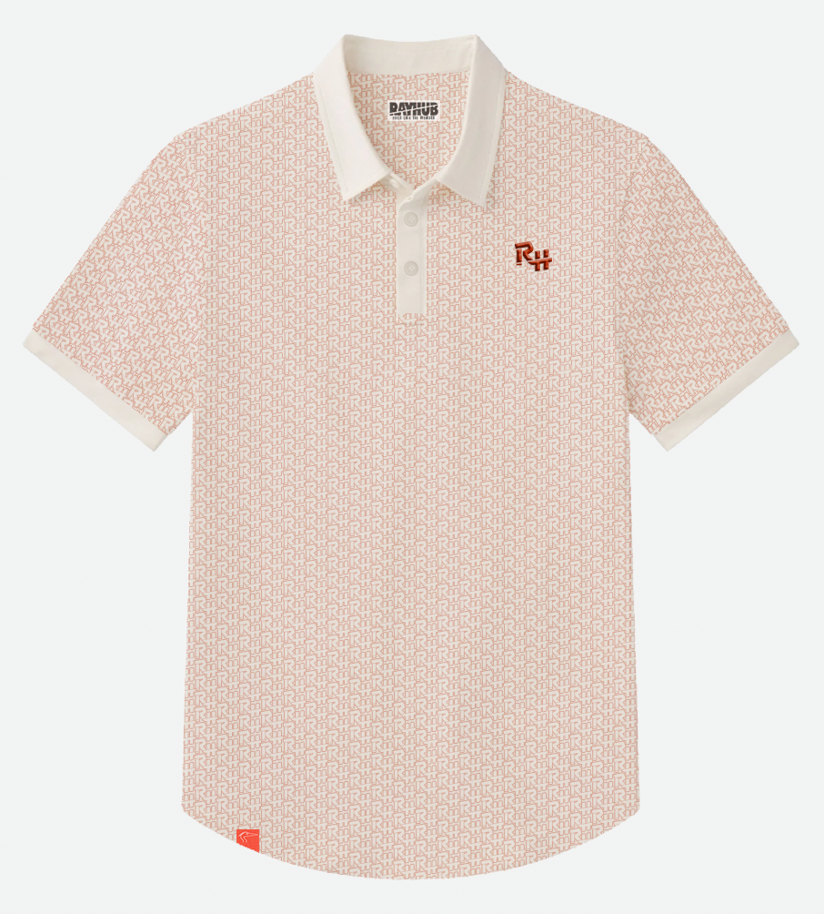 A short-sleeve polo shirt with a red-orange and white geometric RH pattern, featuring a white collar, a white button placket, and a small red embroidered logo on the left chest.